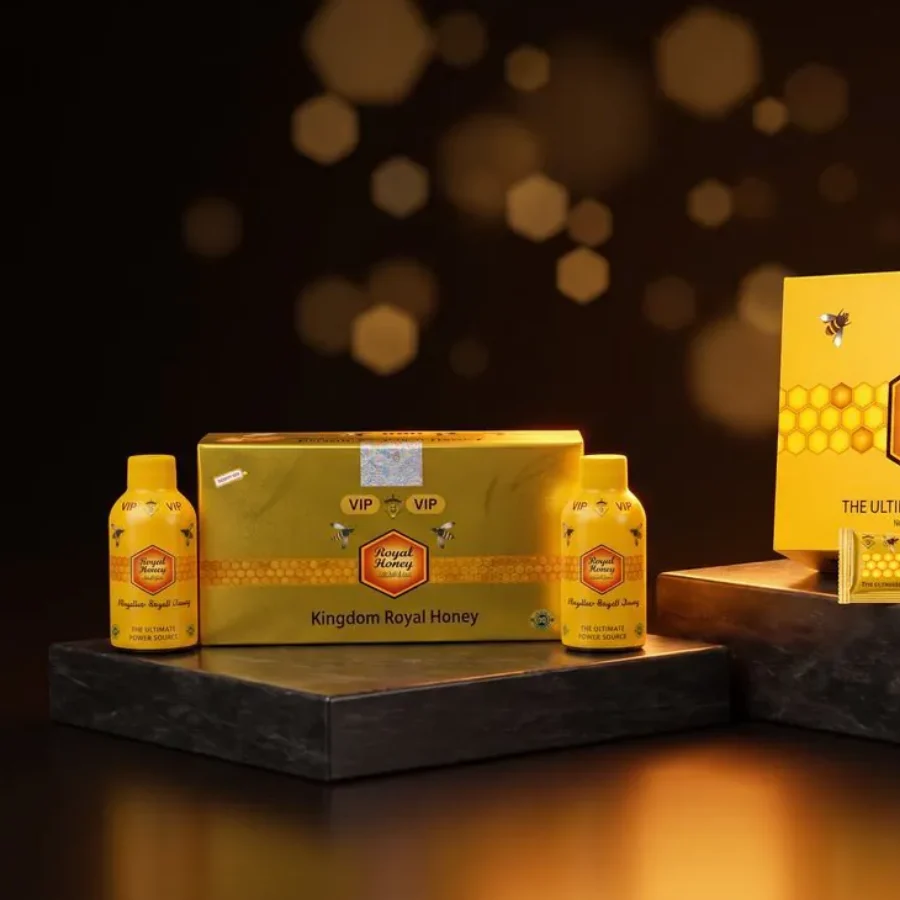 Royal Honey VIP Shot box with two honey shot bottles on a dark stone step in warm light